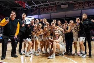 Mr. Sibel (second from the left) and the West Girls Varsity basketball team